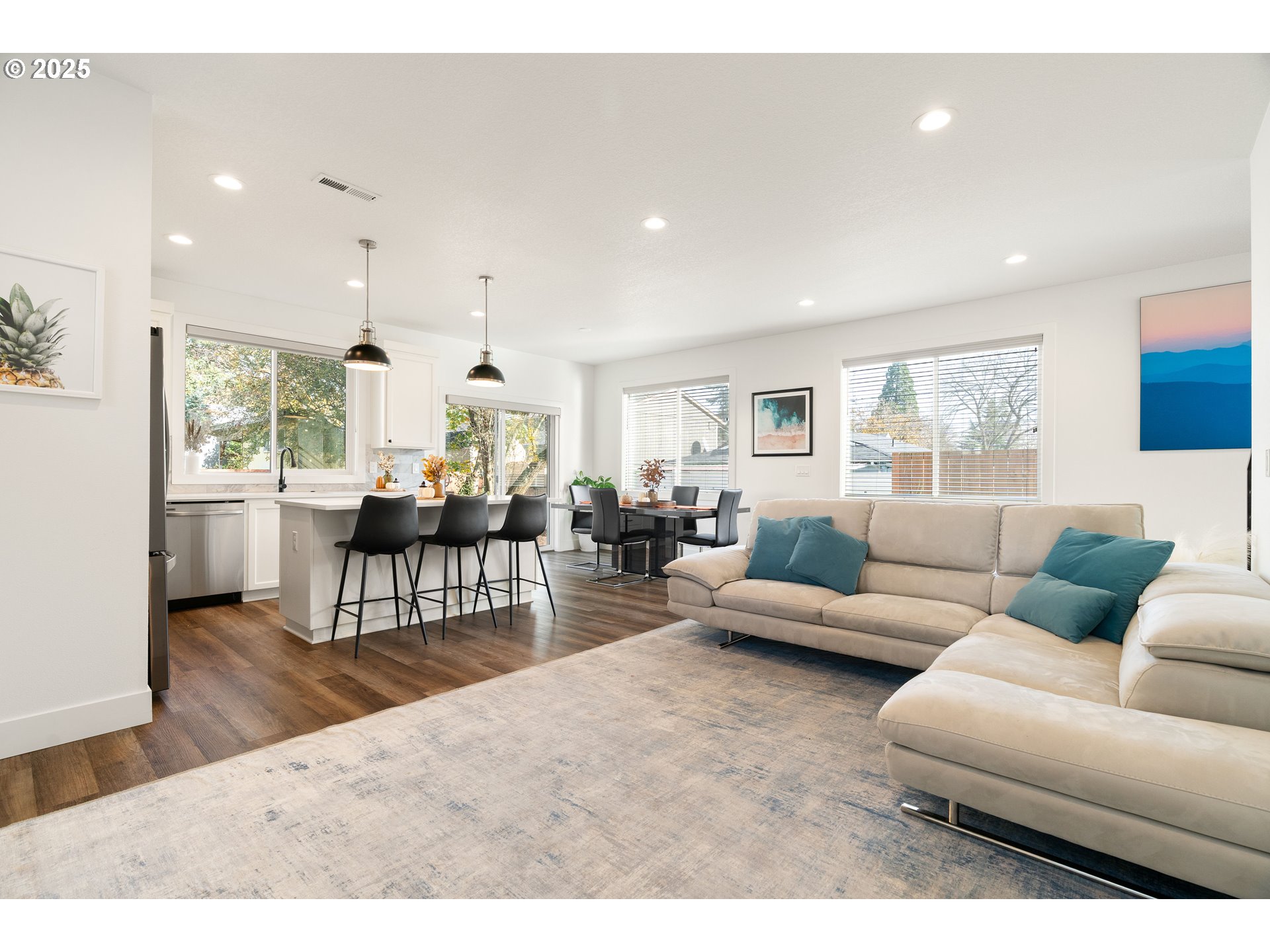 6421 Southeast Cooper Street Portland, OR 97206 - Photo 14 of 44 a living room with furniture wooden floor and a large window