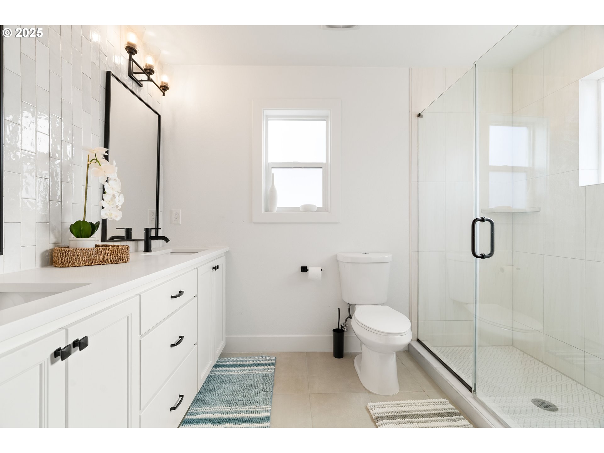 6421 Southeast Cooper Street Portland, OR 97206 - Photo 24 of 44 a bathroom with a double vanity sink toilet and shower