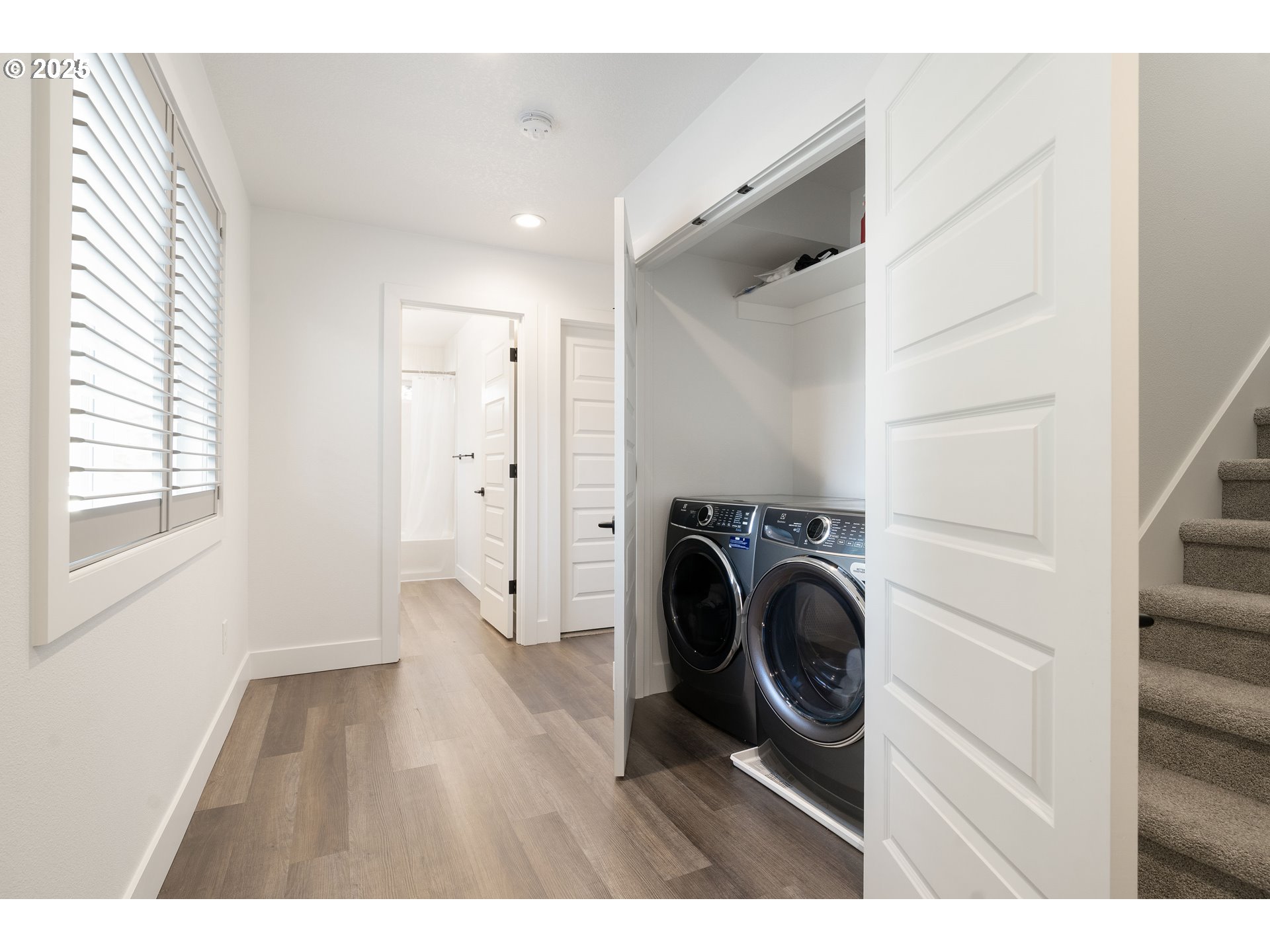 6421 Southeast Cooper Street Portland, OR 97206 - Photo 28 of 44 a view of a hallway with washer and dryer