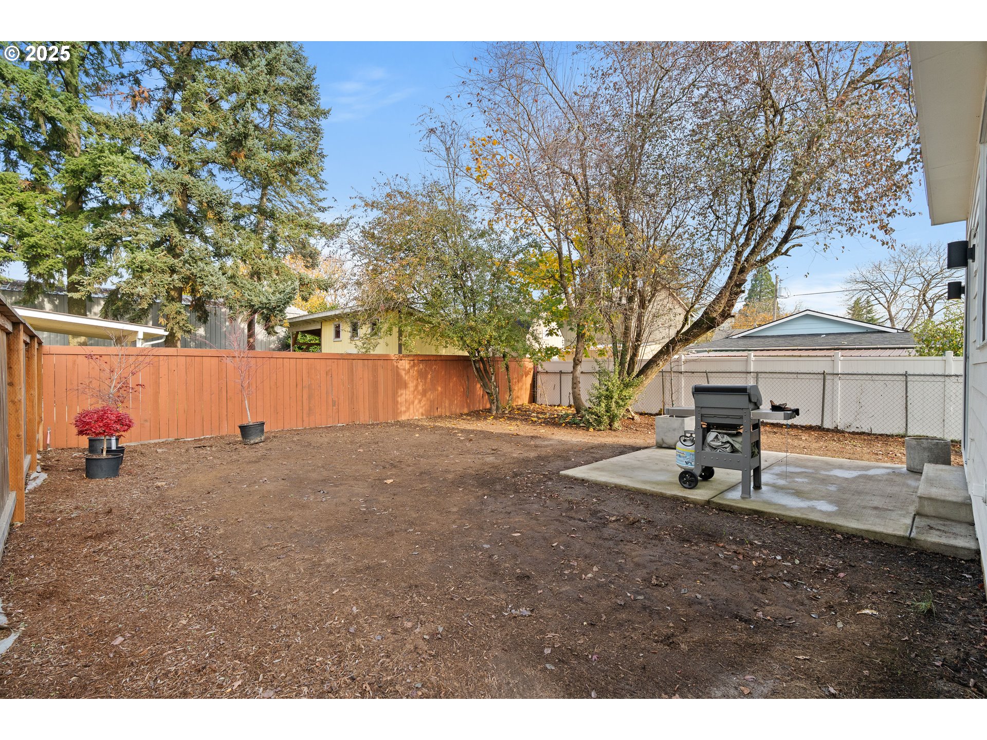 6421 Southeast Cooper Street Portland, OR 97206 - Photo 38 of 44 a backyard of a house with table and chairs
