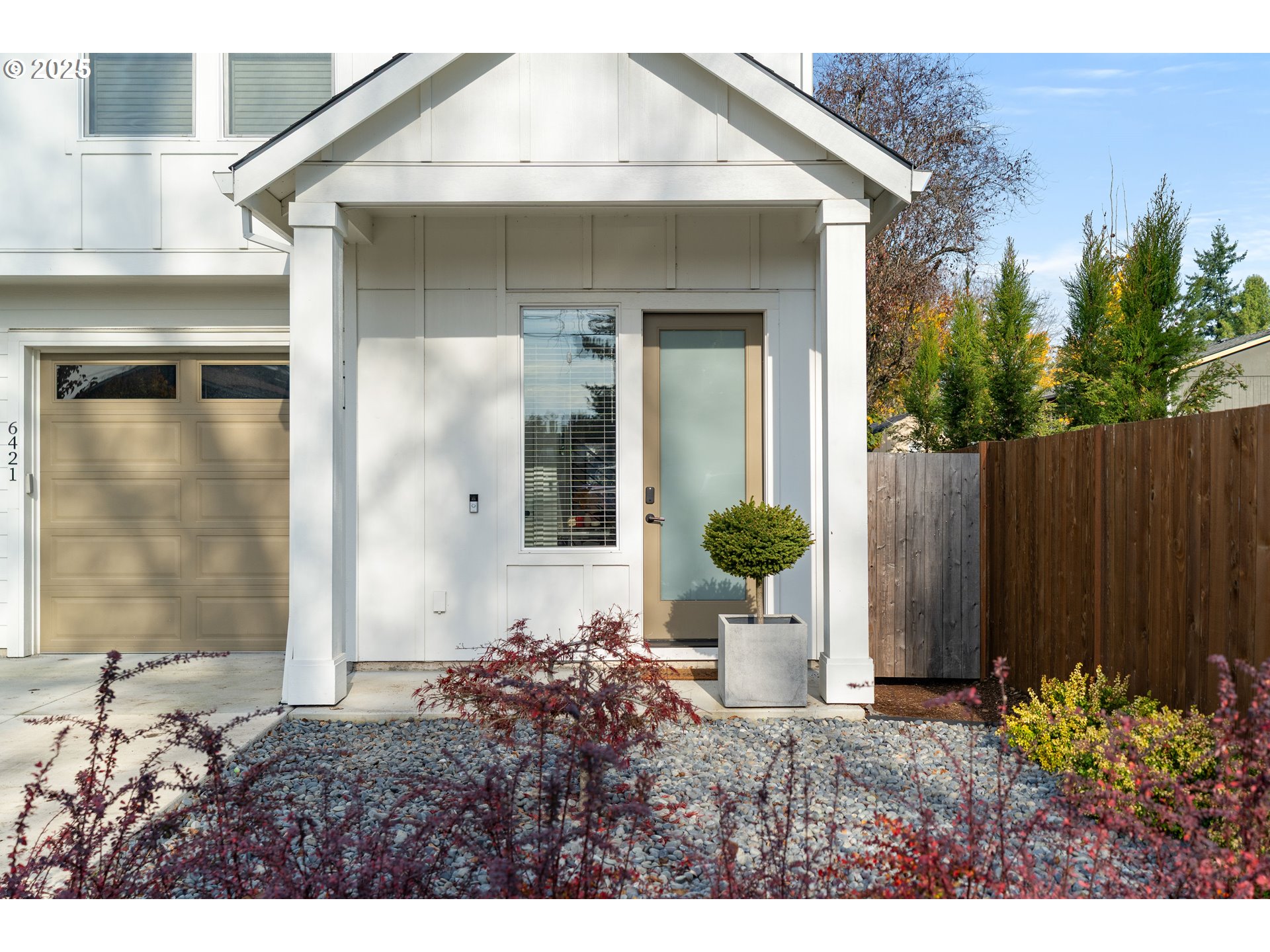 6421 Southeast Cooper Street Portland, OR 97206 - Photo 4 of 44 a view of a house with small yard and plants