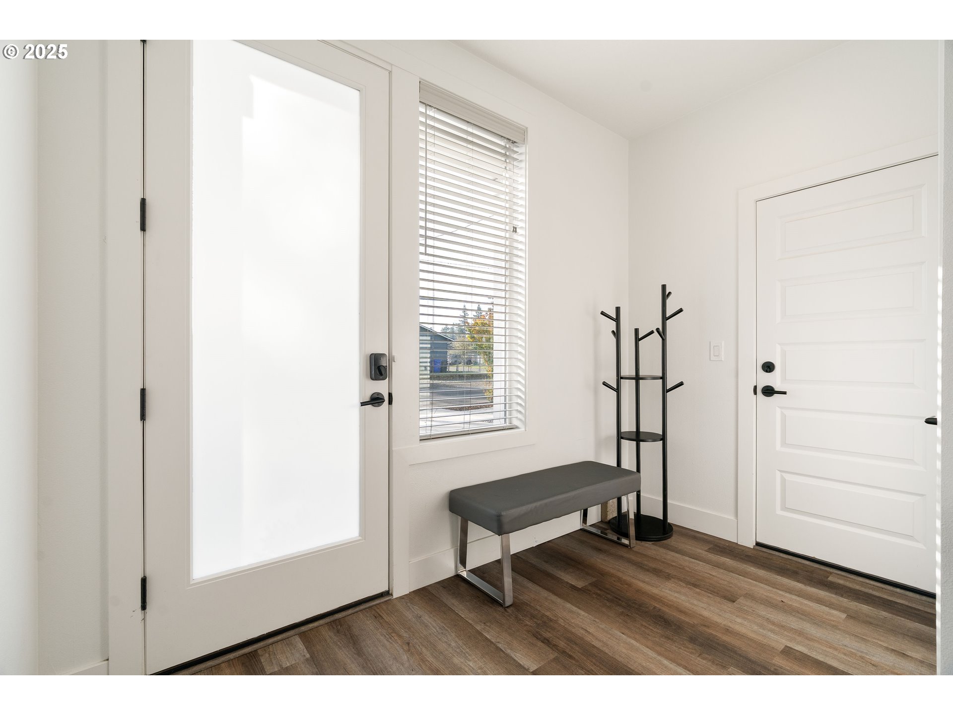 6421 Southeast Cooper Street Portland, OR 97206 - Photo 5 of 44 a view of a livingroom with wooden floor and a window