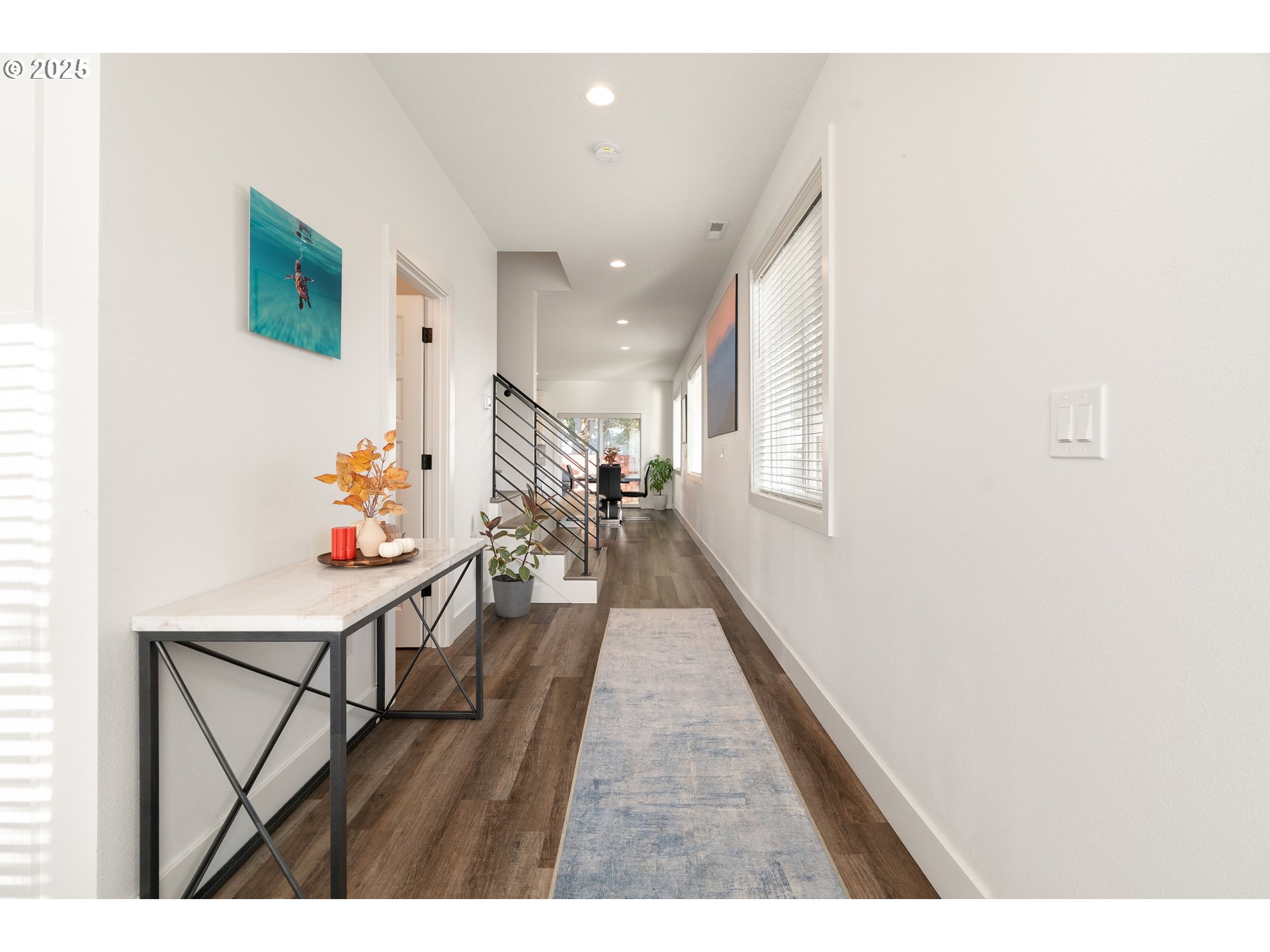 6421 Southeast Cooper Street Portland, OR 97206 - Photo 7 of 44 a hallway with wooden floor and furniture