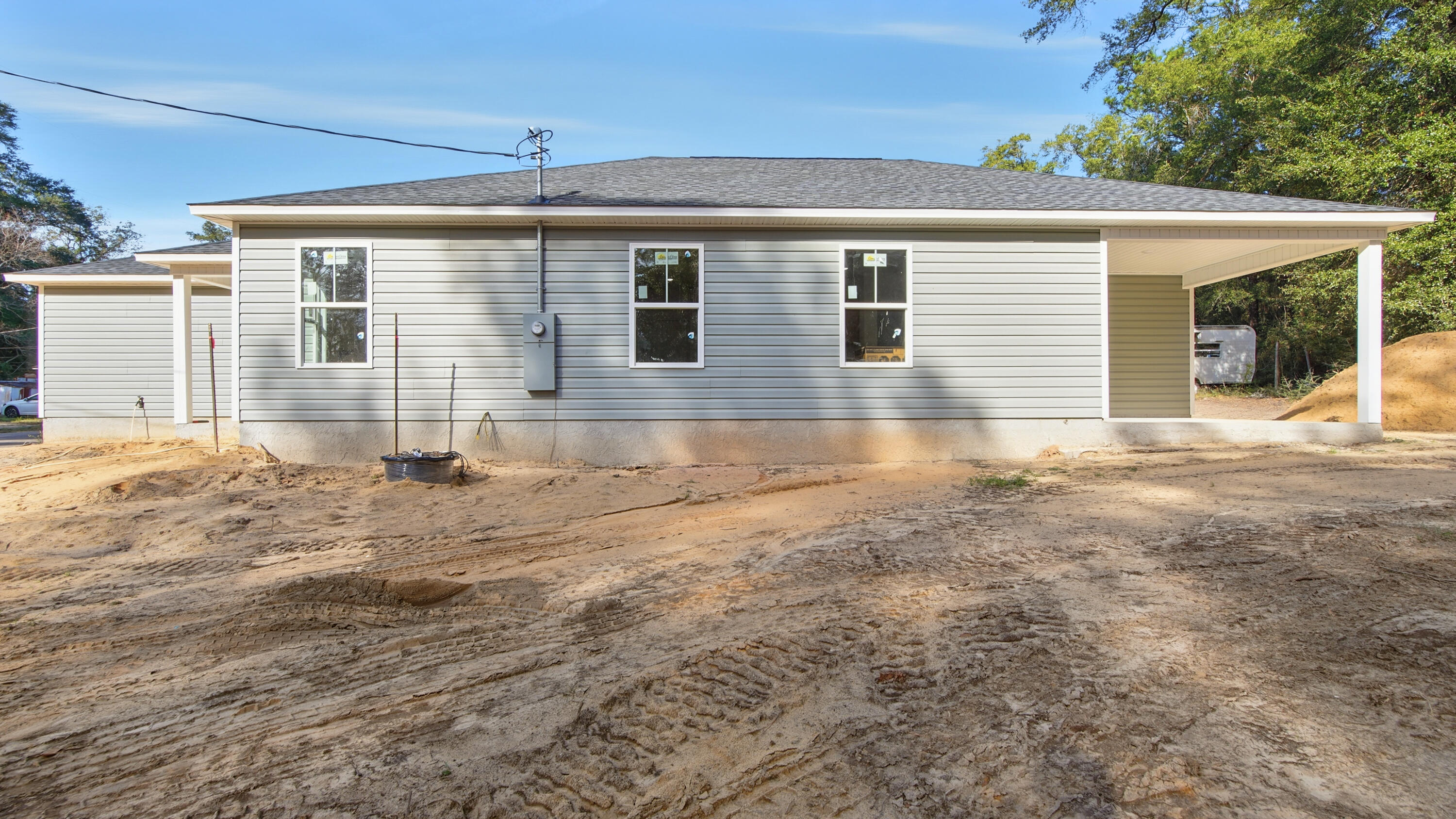 119 Loftin Street DeFuniak Springs, FL 32435 - Photo 12 of 15 a front view of a house with a yard