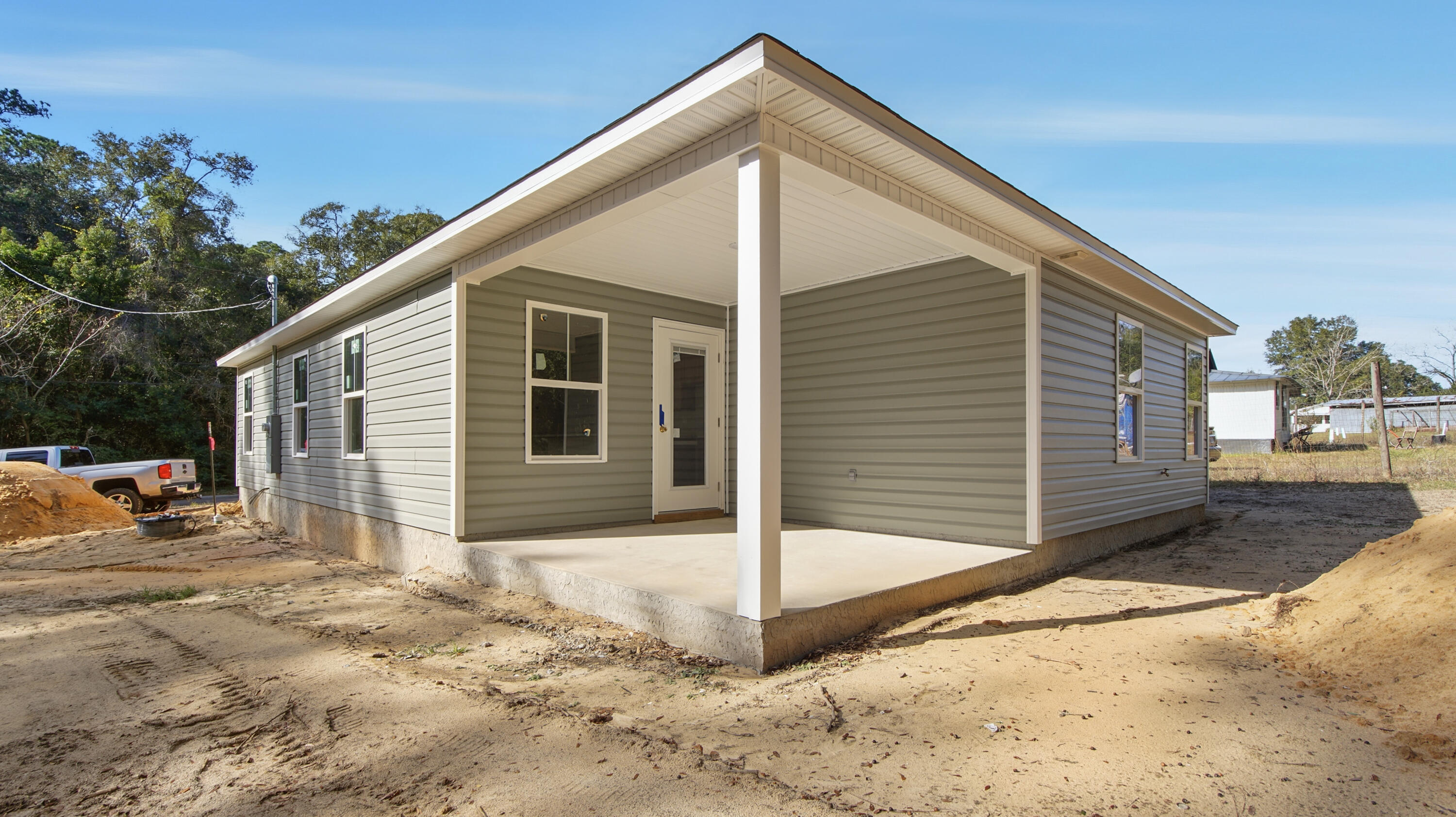 119 Loftin Street DeFuniak Springs, FL 32435 - Photo 13 of 15 a view of a house with wooden fence