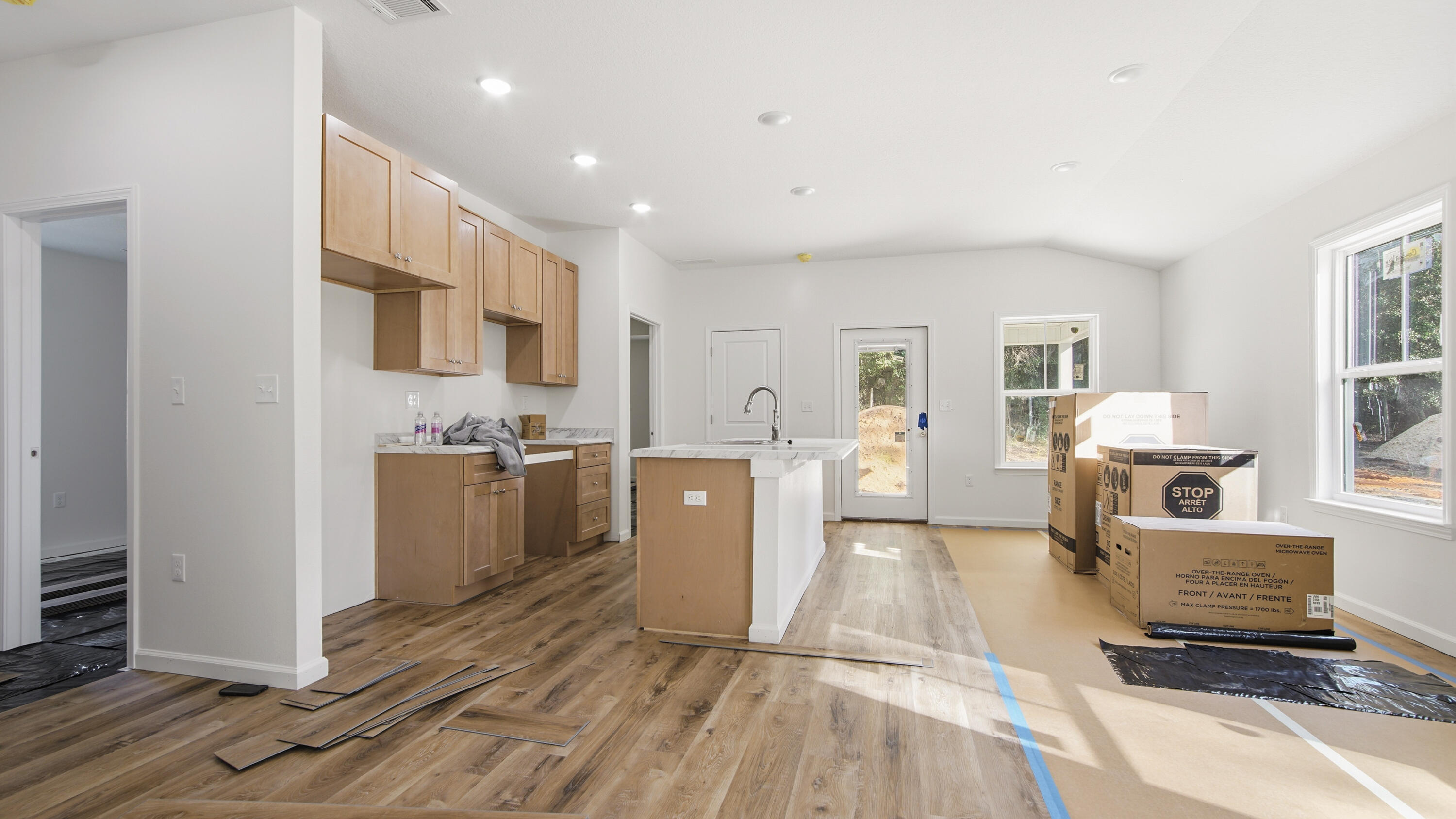 119 Loftin Street DeFuniak Springs, FL 32435 - Photo 5 of 15 a large room with lots of counter space and windows