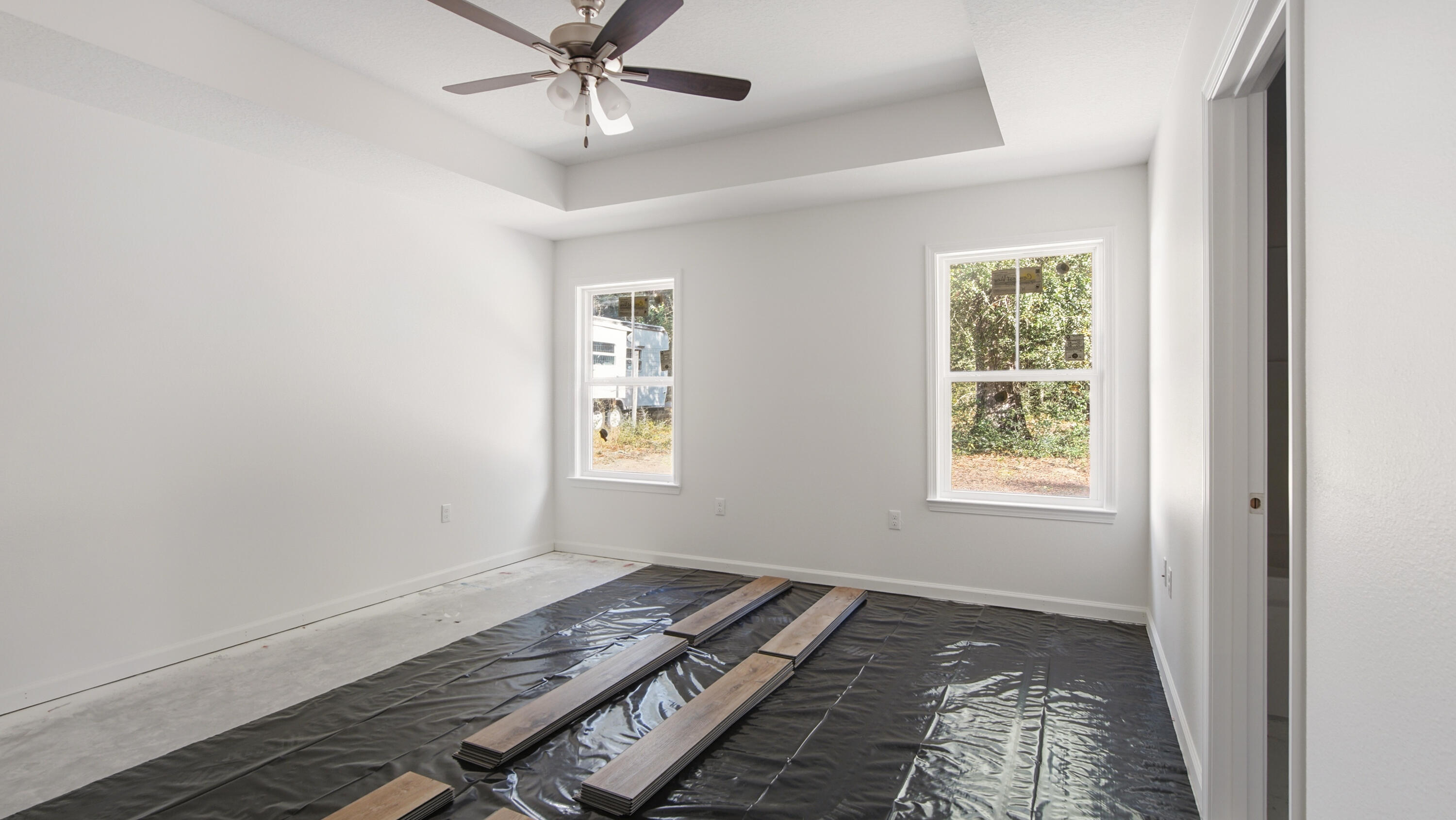 119 Loftin Street DeFuniak Springs, FL 32435 - Photo 6 of 15 an empty room with windows
