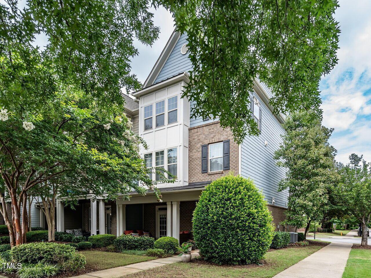 1316 Cornell Place Raleigh, NC 27607 - Photo 1 of 31 a front view of a house with a garden