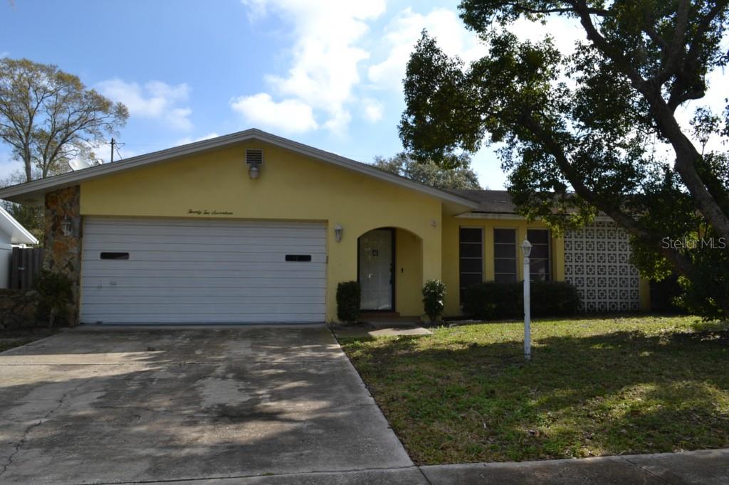 2217 Riviera Drive Clearwater, FL 33763 - Photo 1 of 1 a front view of house with yard