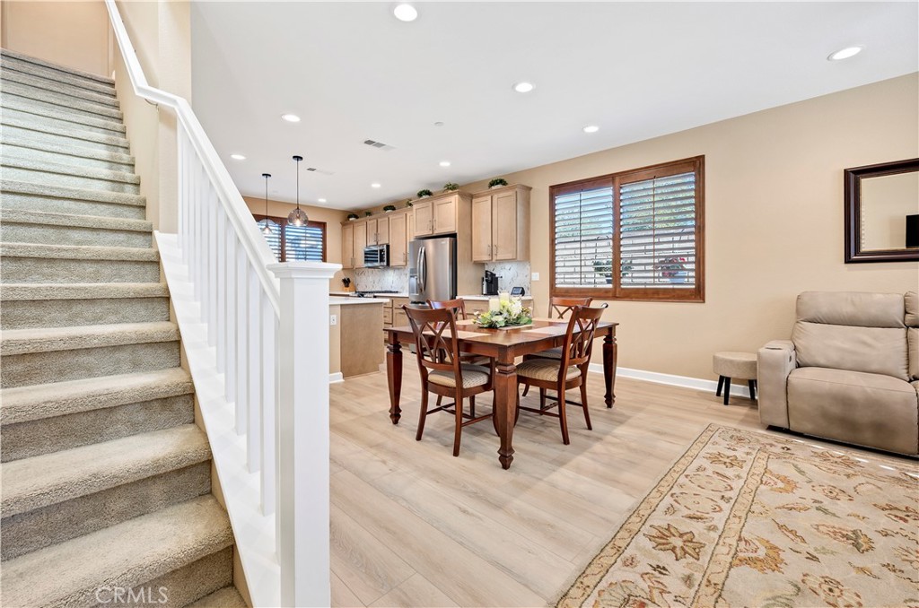 39320 Brunello Way Temecula, CA 92591 - Photo 14 of 52 a view of a dining room with furniture