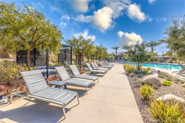 a view of a swimming pool with a lounge chairs
