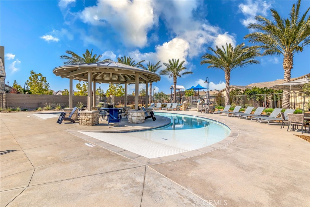 39320 Brunello Way Temecula, CA 92591 - Photo 45 of 52 a view of a patio with swimming pool