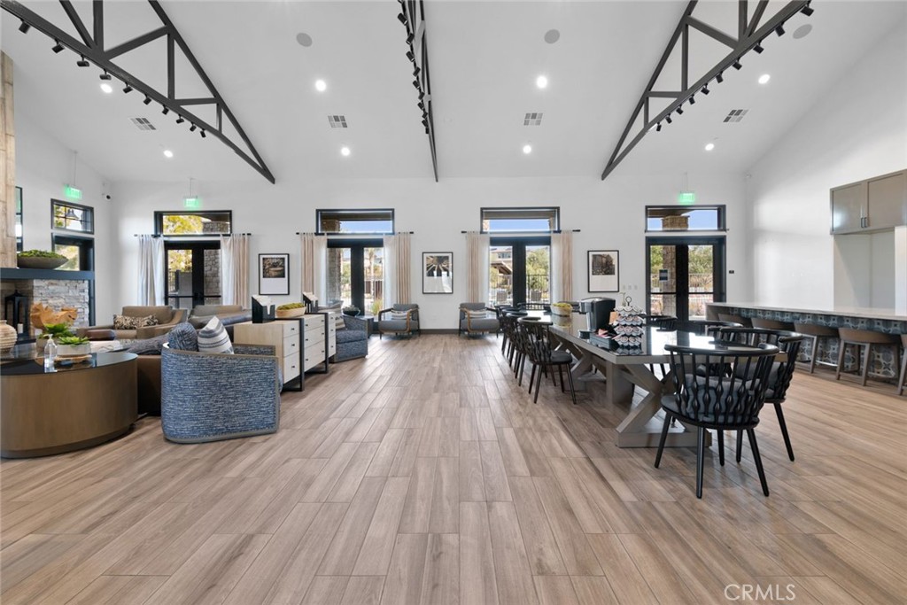 39320 Brunello Way Temecula, CA 92591 - Photo 47 of 52 a view of a dining room with furniture and wooden floor