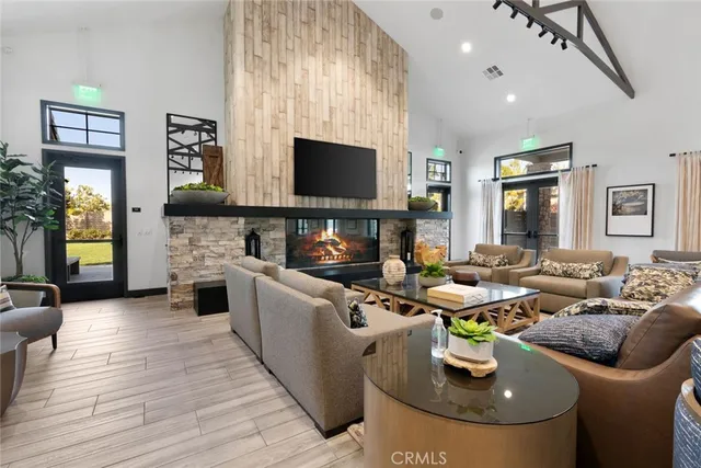 a large room with lots of furniture and a wooden floor