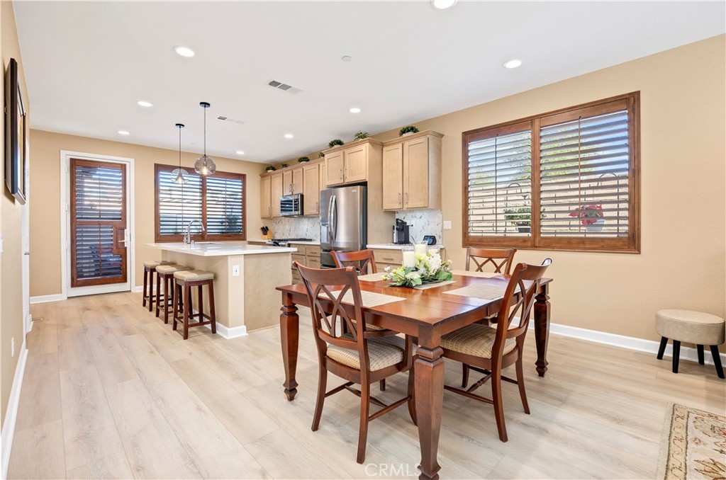 39320 Brunello Way Temecula, CA 92591 - Photo 10 of 52 a dining room with furniture and a large window