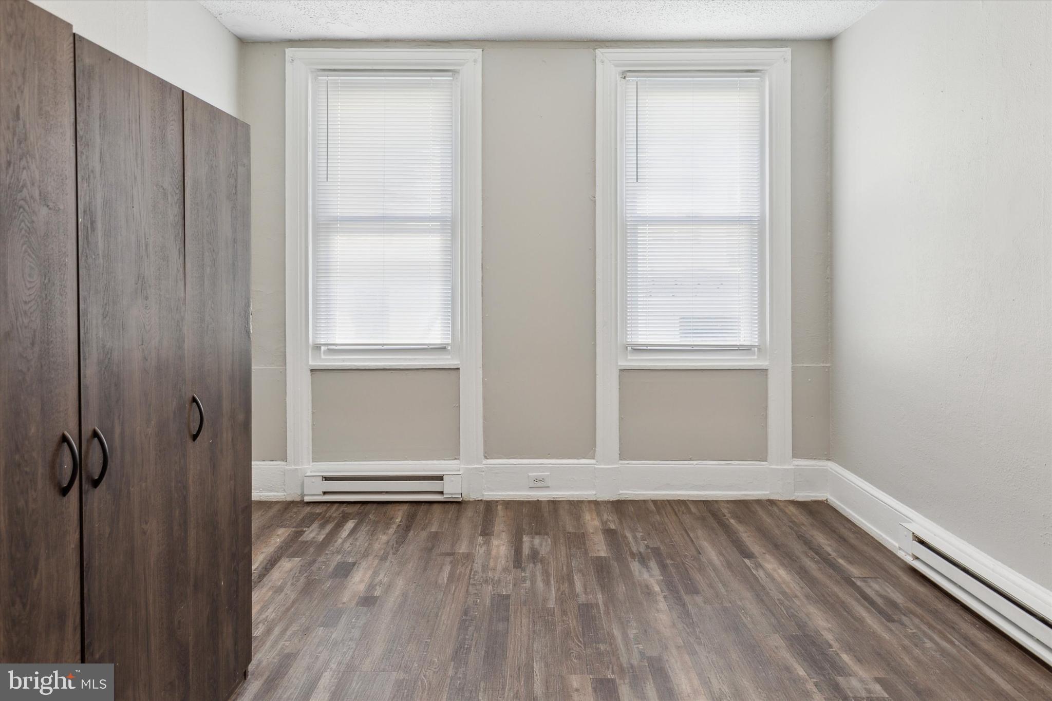 326 East Airy Street, Unit 1 Norristown, PA 19401 - Photo 6 of 11 a view of an empty room with wooden floor and a window