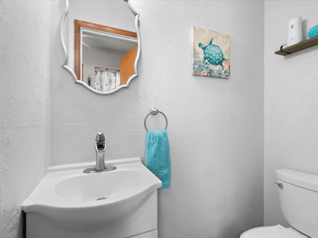 a bathroom with a toilet and a sink