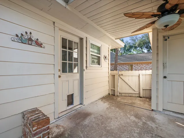 a house view with a sitting space and garden