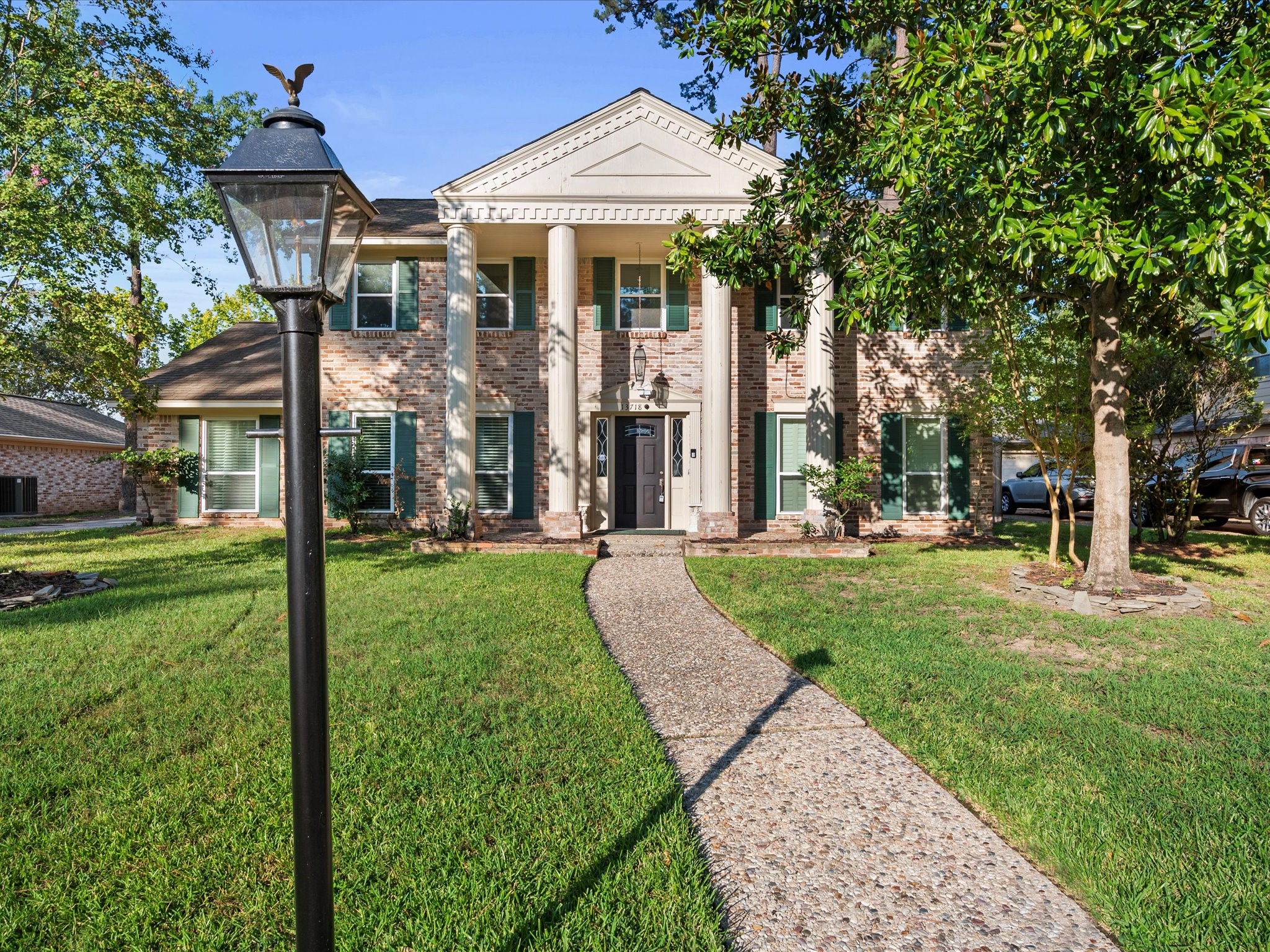 13718 Balmore Circle Houston, TX 77069 - Photo 3 of 35 a front view of a house with a yard