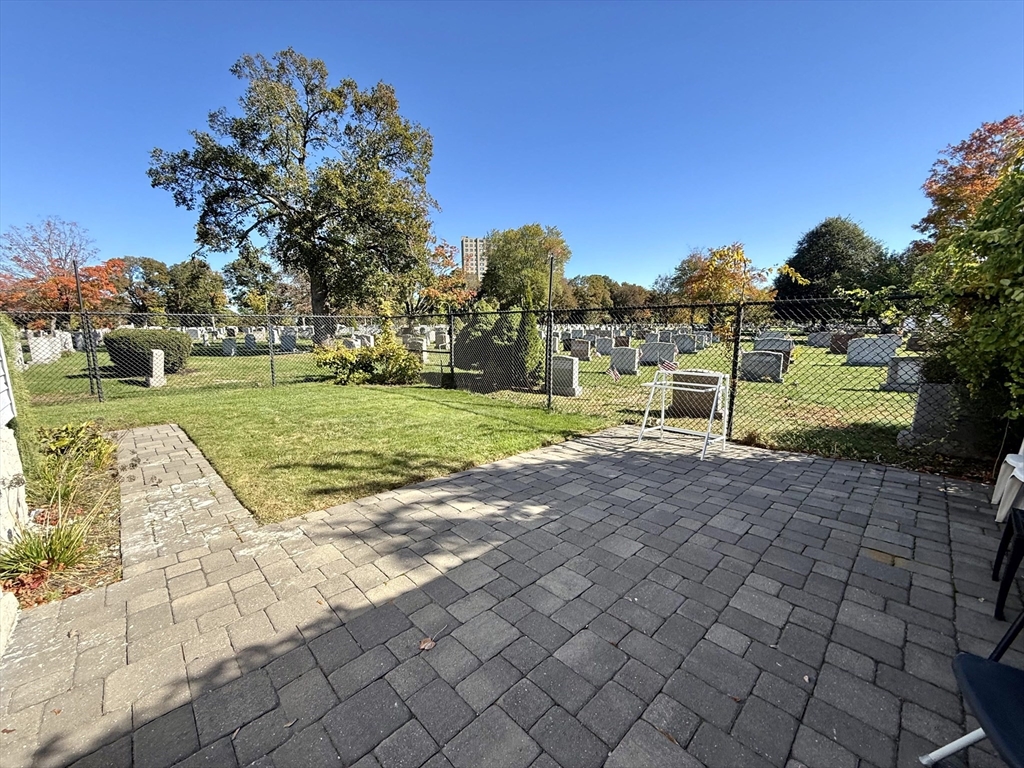 89 Grove Street, Unit 89 Belmont, MA 02478 - Photo 24 of 27 a view of a park with large trees