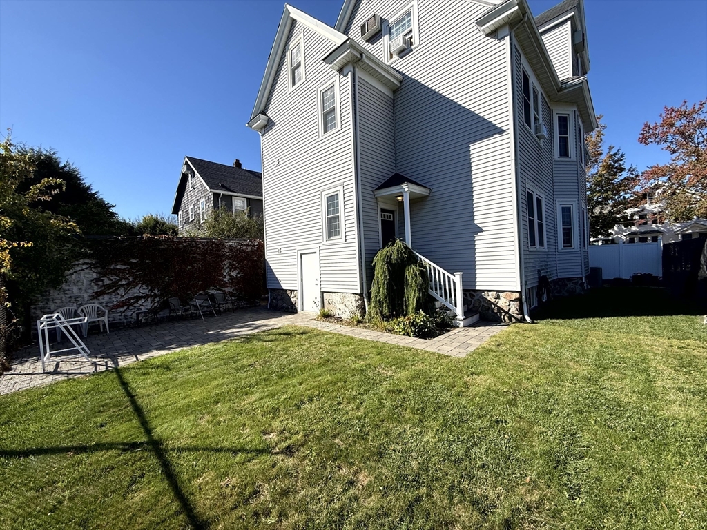 89 Grove Street, Unit 89 Belmont, MA 02478 - Photo 25 of 27 a view of back yard of the house