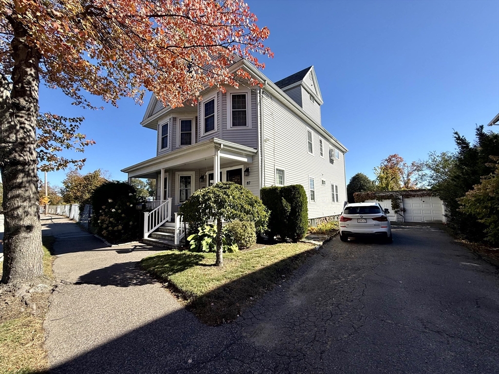 89 Grove Street, Unit 89 Belmont, MA 02478 - Photo 6 of 27 a view of a car park in front of house