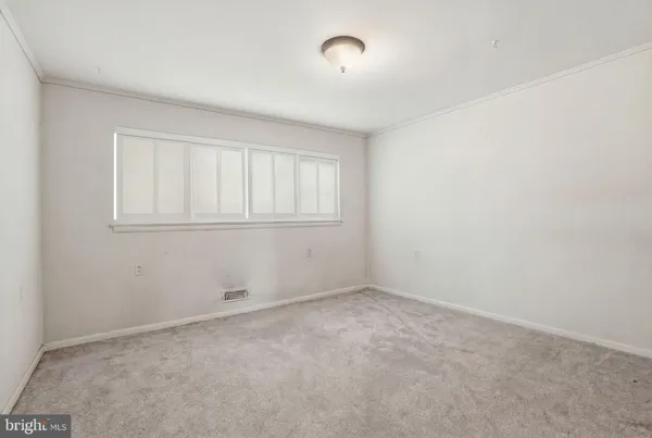 a view of a livingroom with furniture and window