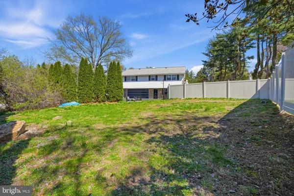 a view of a swimming pool with an outdoor space and seating area