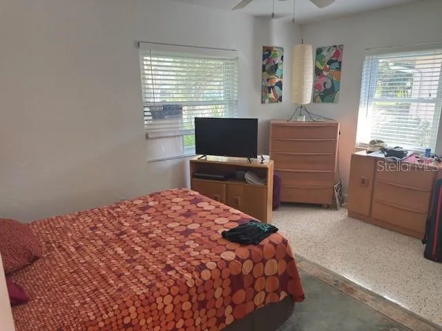 a bedroom with a bed and furniture