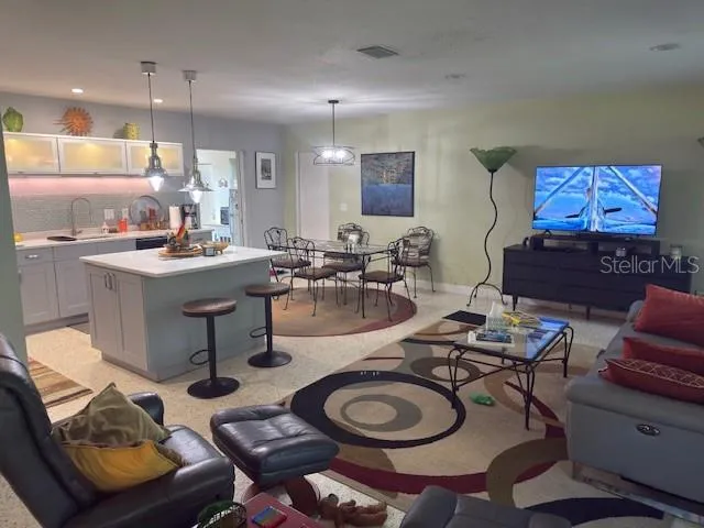 a kitchen with a table and chairs in it