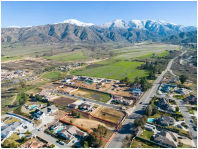 a view of a city with mountains in the background