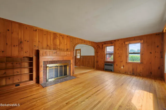 a view of stairs and wooden floor