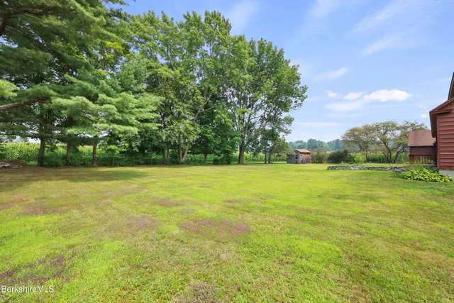 a view of outdoor space with deck and yard