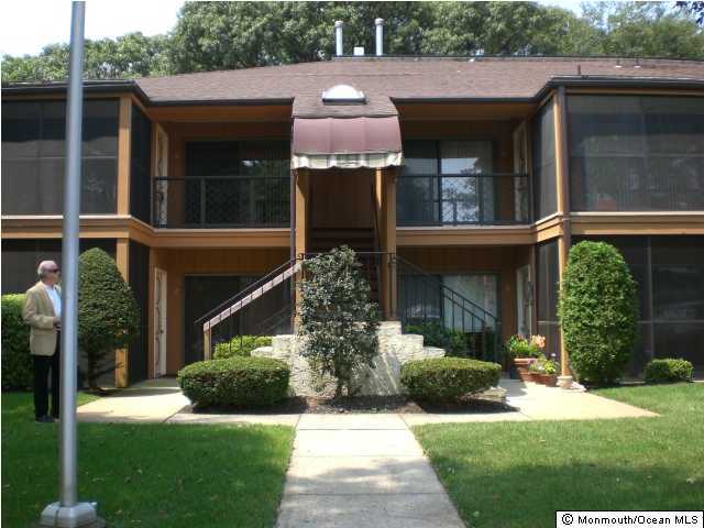 1501 Hulse Road, Unit 19 Point Pleasant, NJ 08742 - Photo 2 of 3 a front view of a house with garden