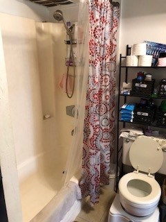 493 Pio Drive, Unit 104 Wailuku, HI 96793 - Photo 4 of 4 a white toilet sitting next to a bath tub and shower