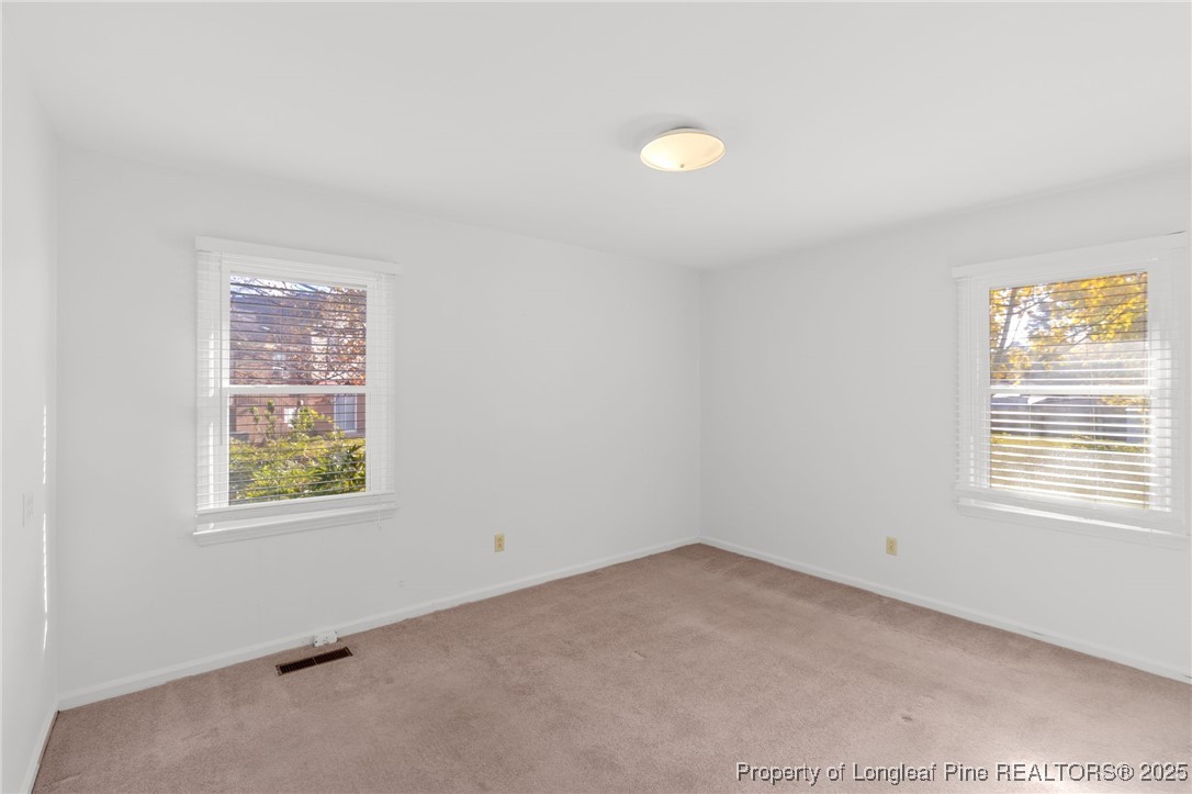 5123 Chesapeake Road Fayetteville, NC 28311 - Photo 14 of 24 an empty room with windows