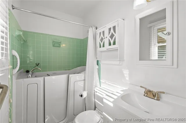 a view of a house with backyard porch and sitting area