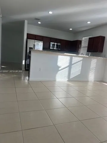 a view of a refrigerator in the kitchen