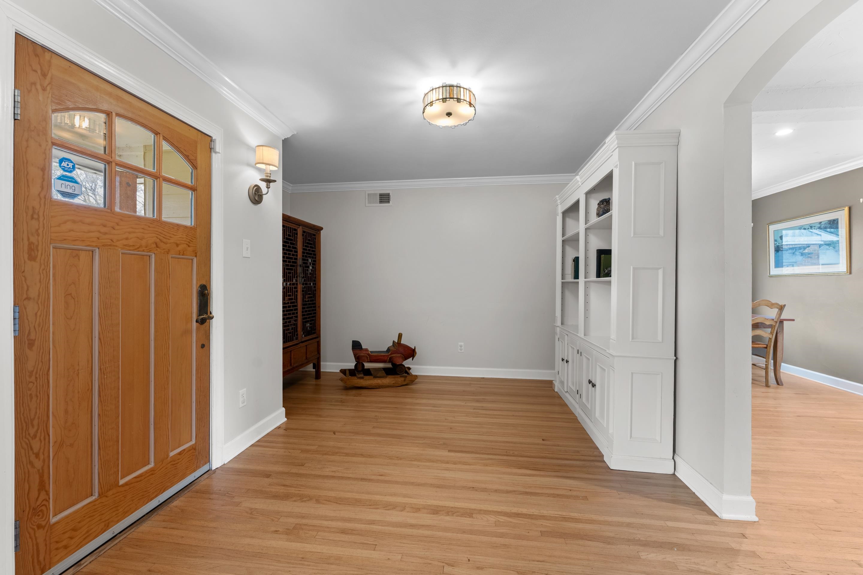 400 Rosser Road Memphis, TN 38120 - Photo 11 of 26 a view of a livingroom with wooden floor and a flat screen tv