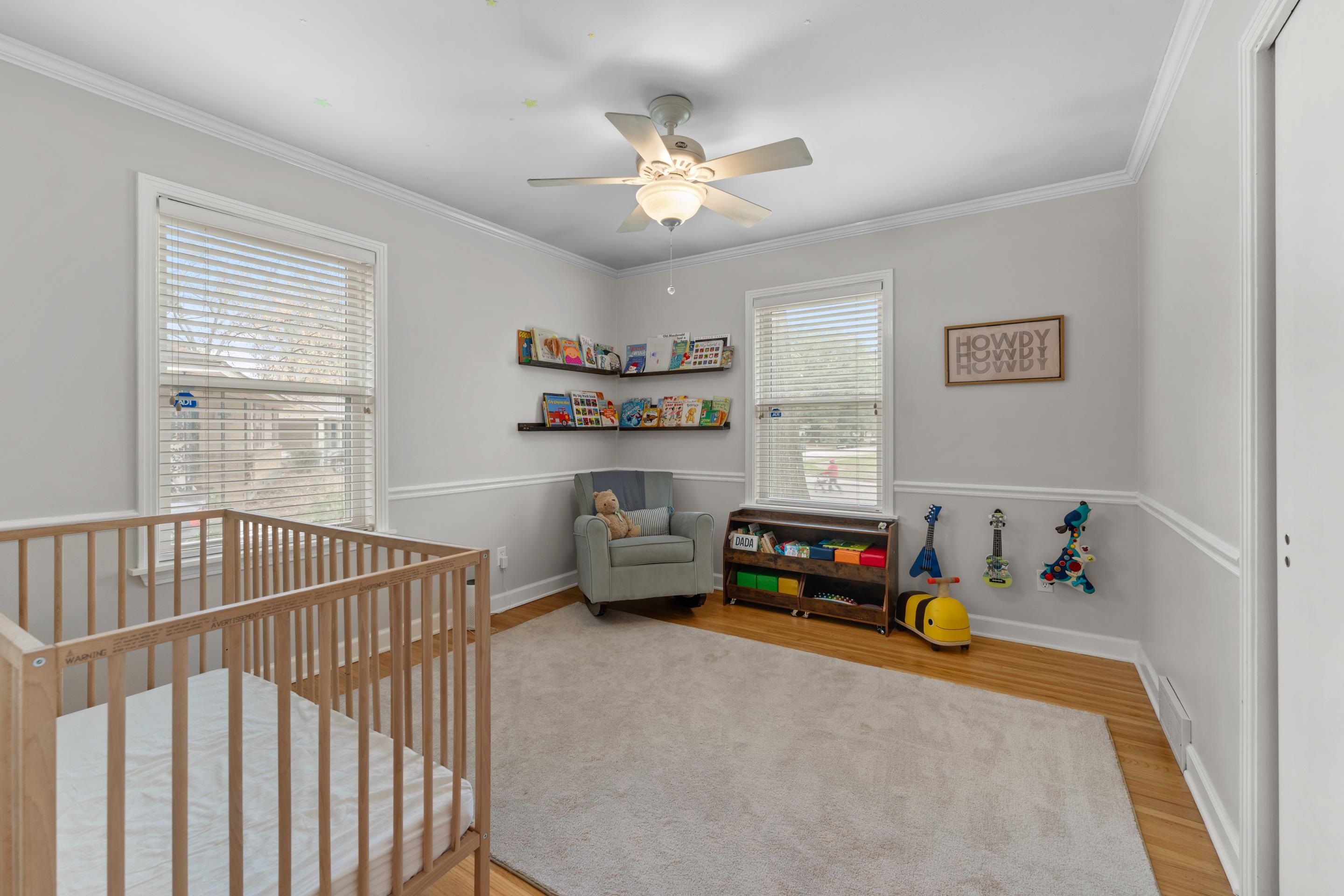 400 Rosser Road Memphis, TN 38120 - Photo 14 of 26 a bedroom with a bed and a chandelier