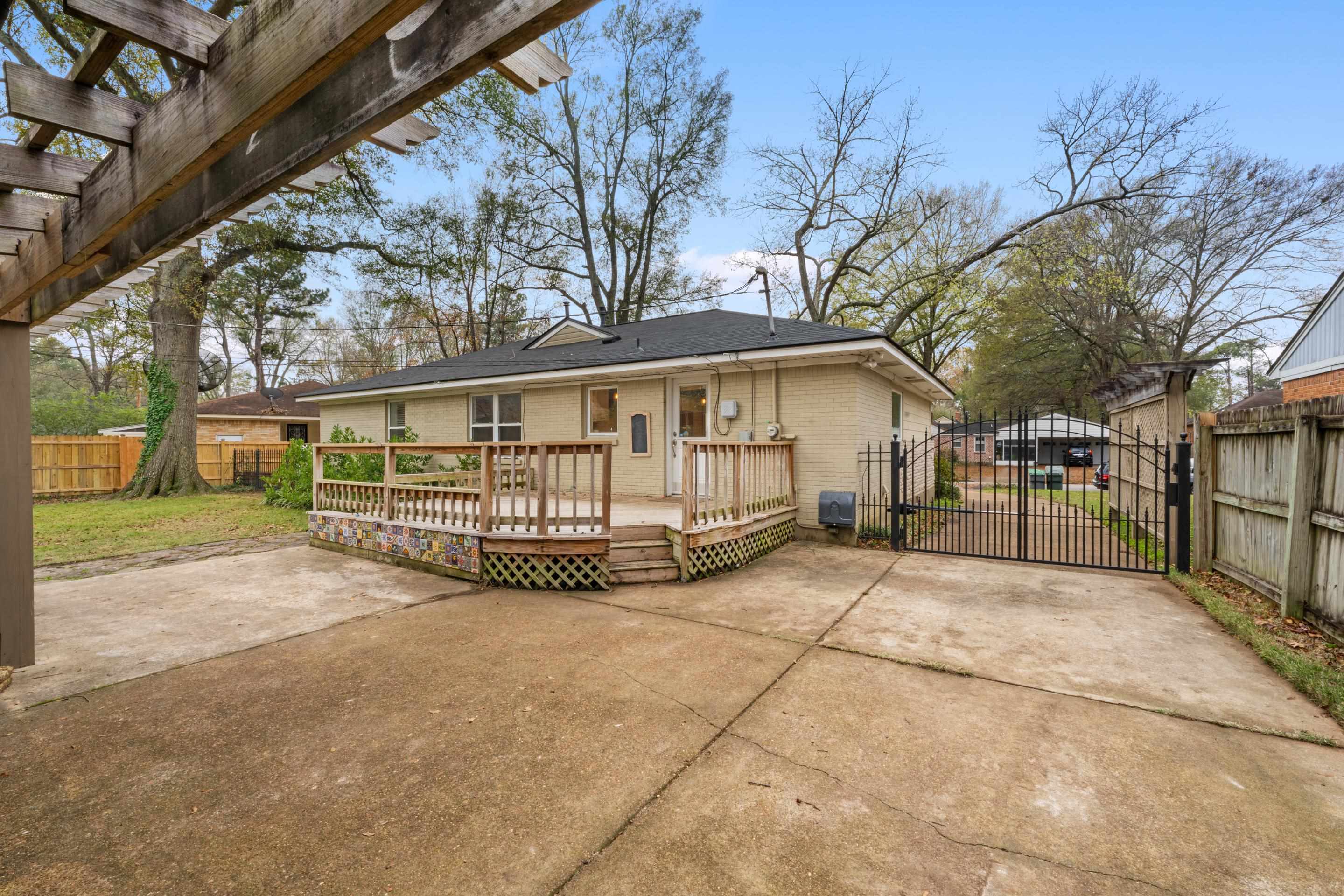 400 Rosser Road Memphis, TN 38120 - Photo 23 of 26 a view of house with a yard and potted plants