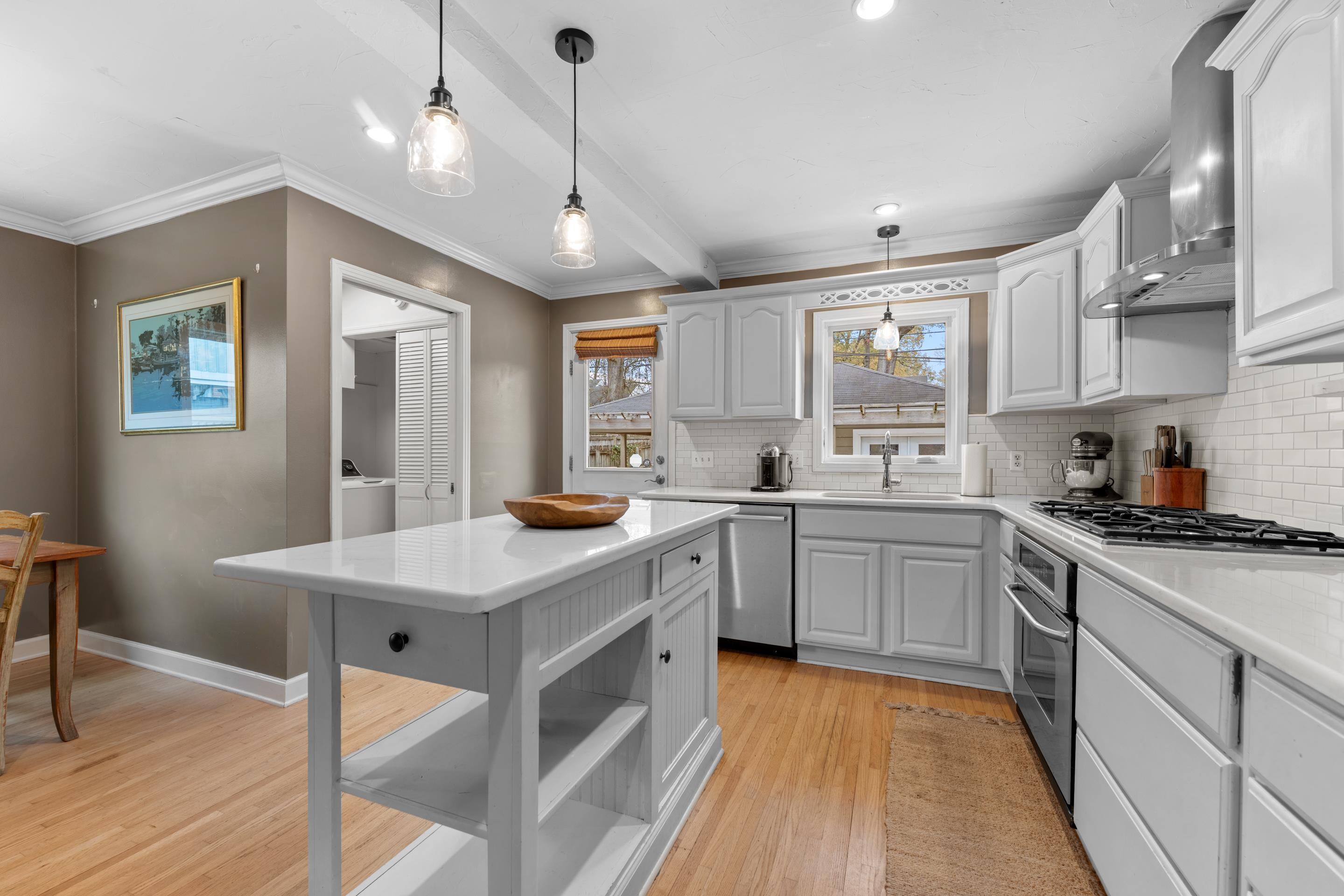 400 Rosser Road Memphis, TN 38120 - Photo 4 of 26 a kitchen with granite countertop a sink appliances cabinets and wooden floor