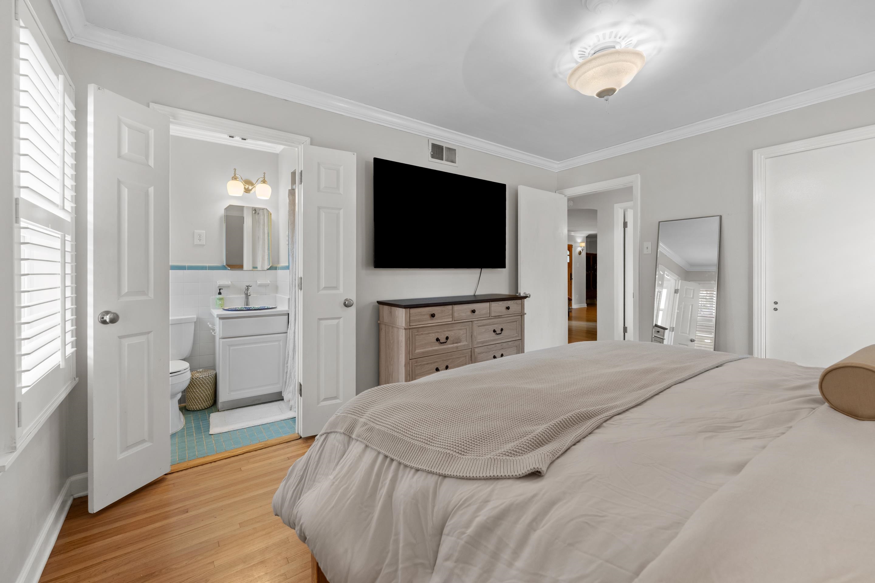 400 Rosser Road Memphis, TN 38120 - Photo 8 of 26 a bedroom with a bed and a flat screen tv