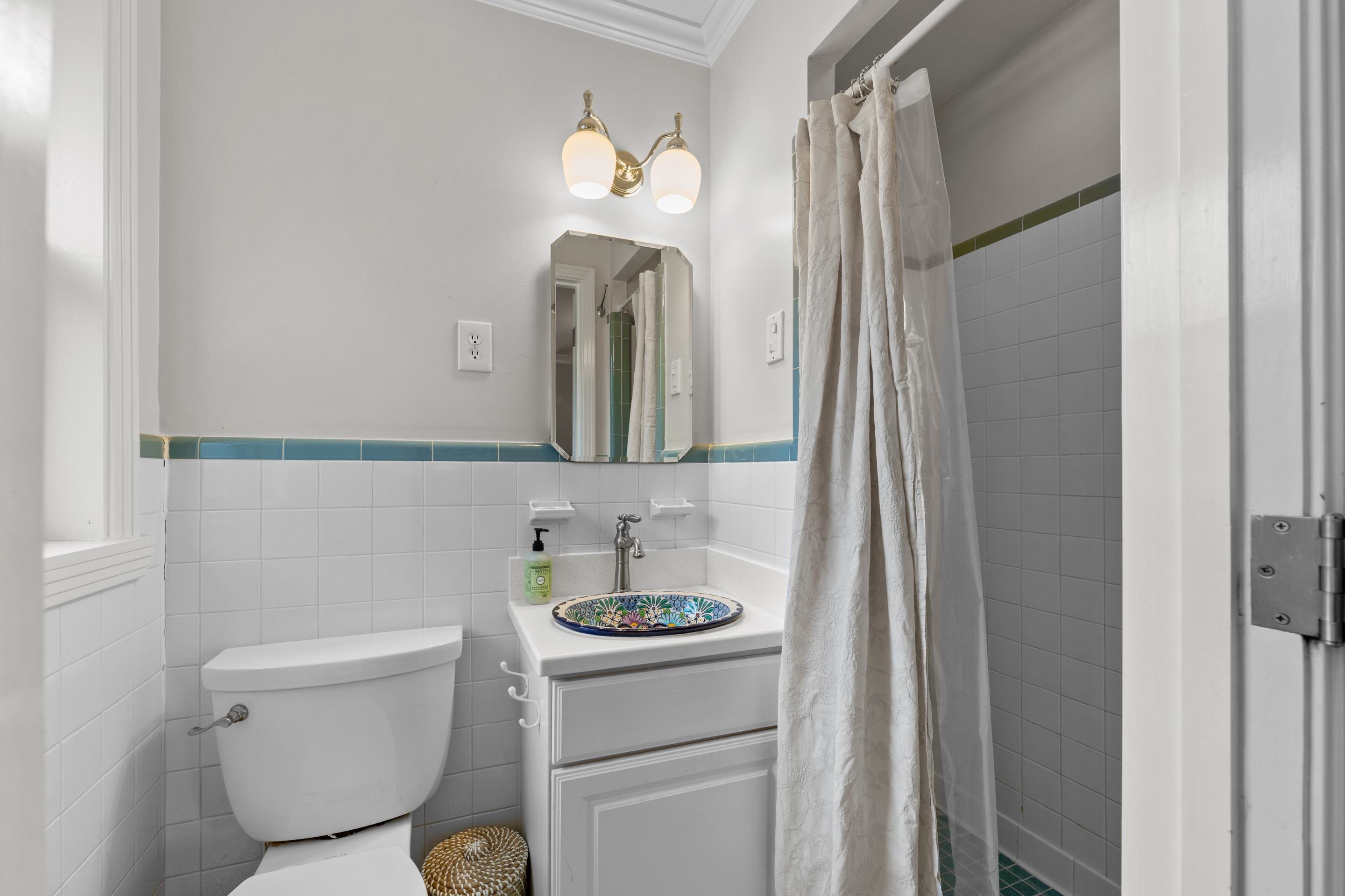 400 Rosser Road Memphis, TN 38120 - Photo 9 of 26 a bathroom with a toilet sink and mirror