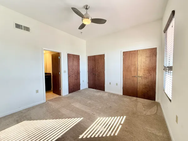 a view of an empty room with a fireplace