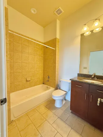 a view of a house with a large tree