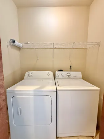 a view of a livingroom with a ceiling fan and window