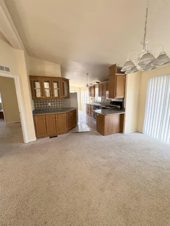 a open kitchen with cabinets stove and oven