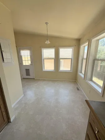 an empty room with windows