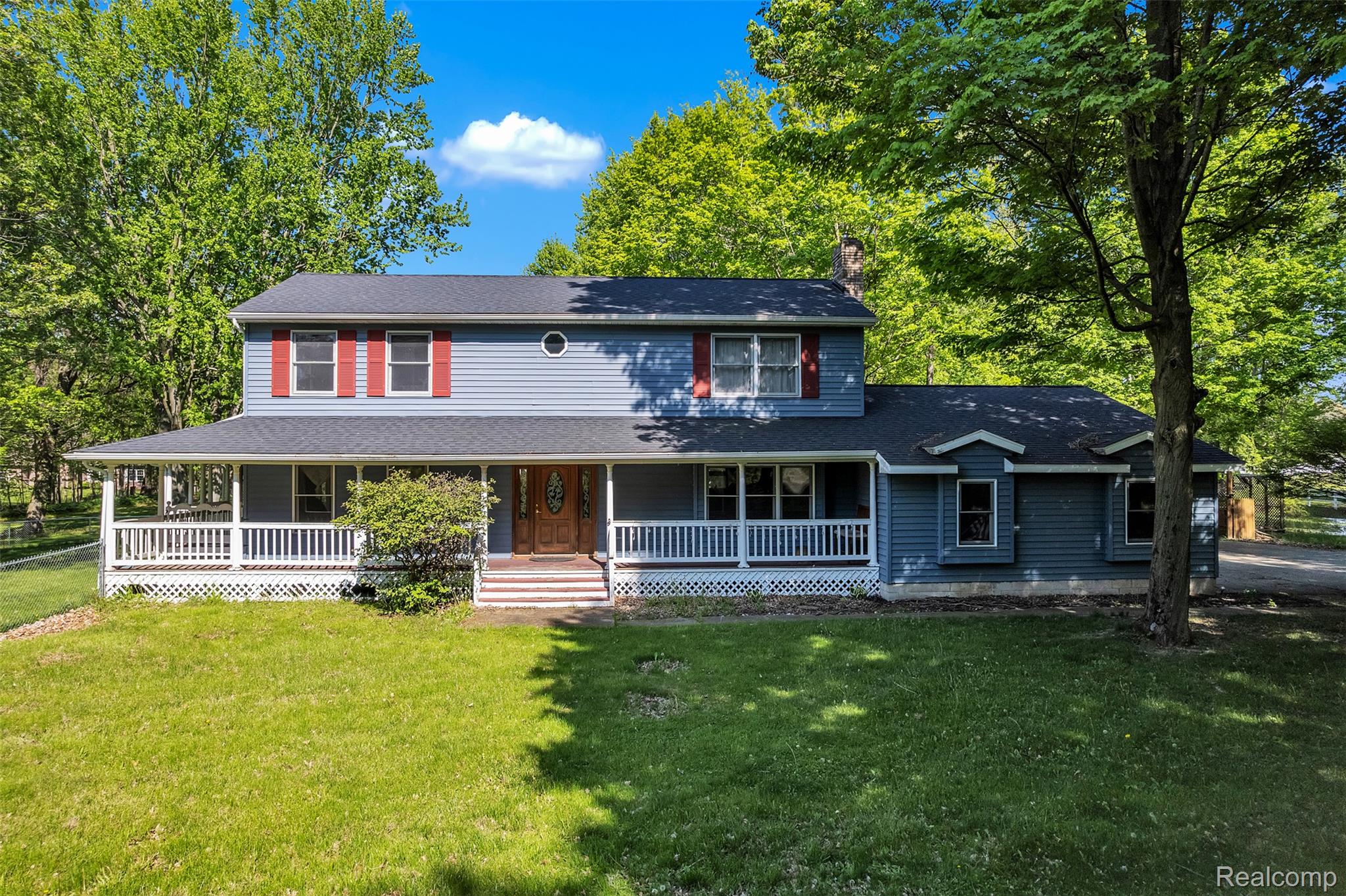 1345 Ives Road Mason, MI 48854 - Photo 88 of 92 Farmhouse featuring covered porch, a chimney, a front lawn, and a shingled roof